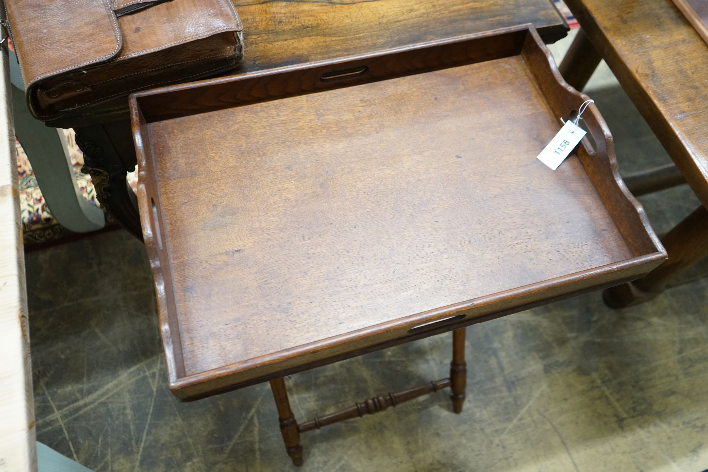 A late Victorian oak butler's tray on folding stand, width 62cm, depth 42cm, height 80cm